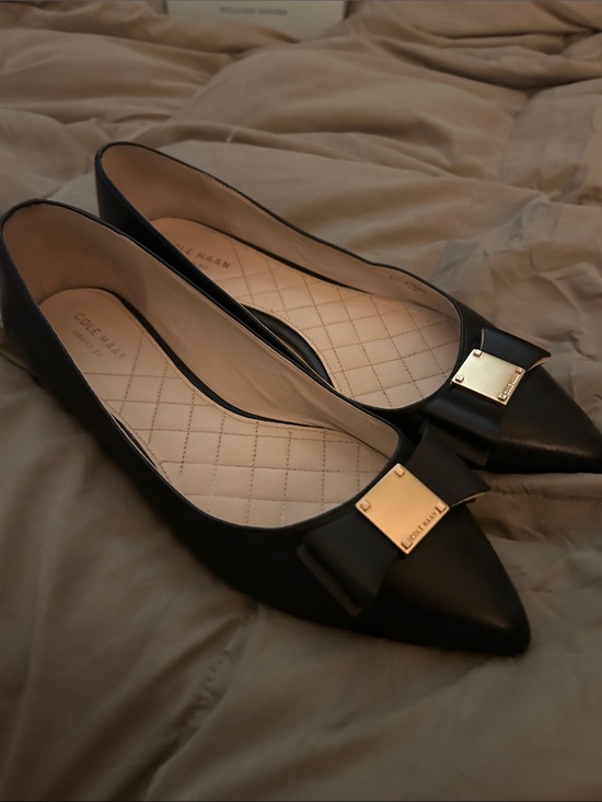 Cole Haan Shoes - Cole Haan Black Pointed Toe Bow Flats with Gold Plaque NWOT